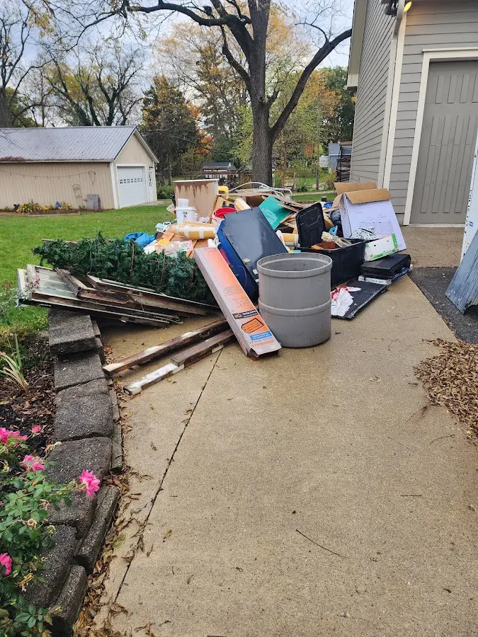 Dumpster being loaded with debris for 30 Yard Dumpster Rental in Hughson